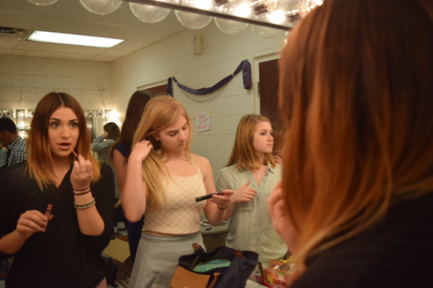 Cast members get ready for the show.