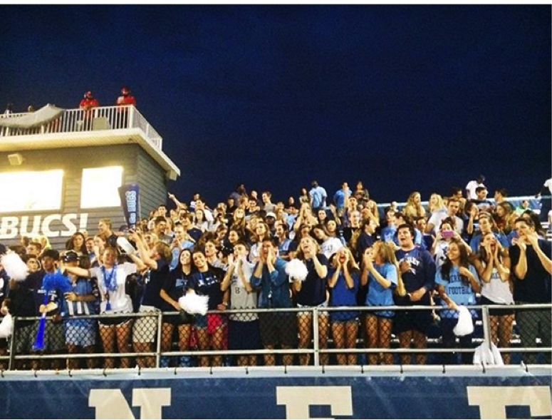 Students cheer for the Berkeley Buccaneers at the football game on August 28, 2015.