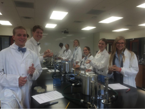 These Microbiology students are excited as they observe bacterial organisms and learn to use agar plates – all in the first week!