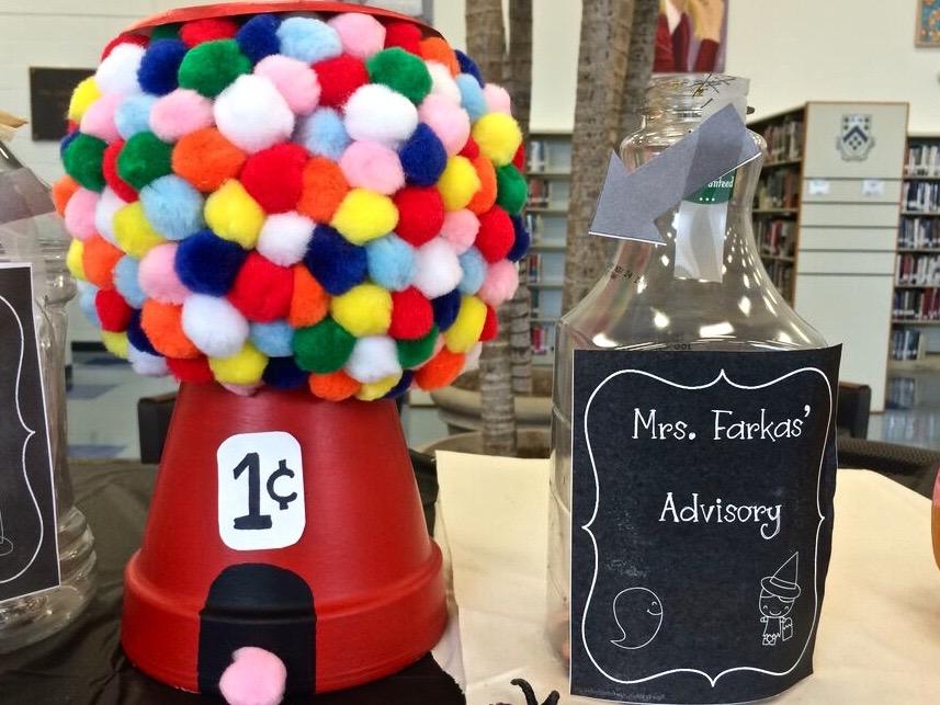 Incorporating both the full array of products in the art room with a sharp wit, Mrs. Farkas Advisory group pumpkin is sure to have all those with a sweet tooth dropping pennies. The smart use of a flower pot provides and excellent base for the now fluffy pumpkin, elevating it from the rest of the competition.