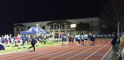 The boys’ track team prepares to finish the track events with the 4x400-meter relay. 