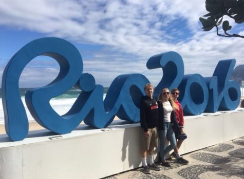 CHEERING ON TEAM USA: Wade Munger 18, Sarah Munger 19 and Caleb Munger 21 (from left) stand in front of the Rio 2016 sign in Rio, Brazil where the 2016 Summer Olympics took place. The Mungers supported Team USA in the stands as various teams won gold throughout the games. Munger stated, Although many different countries were there cheering on their teams, there definitely was a sense of national pride for Team USA at every event.