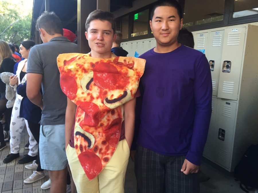 YOU ARE WHAT YOU EAT: The spirit of Halloween exists in Upper Division too. Ben Graham ’19 and Richard Shao ’19 (from left) dress up as different foods; Graham chose to be pizza and Shao decided to be a member berry from the show South Park.