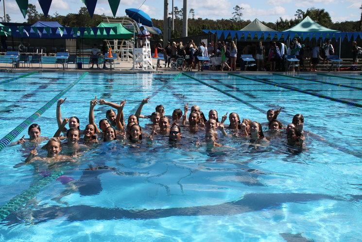 ALWAYS SWIMMING: The Bucs couldn't stay out of the pool, pushing Coach Rosepapa and Coach Signorin in the pool with them.