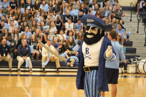 LET’S GO BUCS: Bucky surprises the crowd at all school convo to help them get off their feet and cheer. At this all-school convo Richard Shao ’19 was the man inside the Bucky costume.