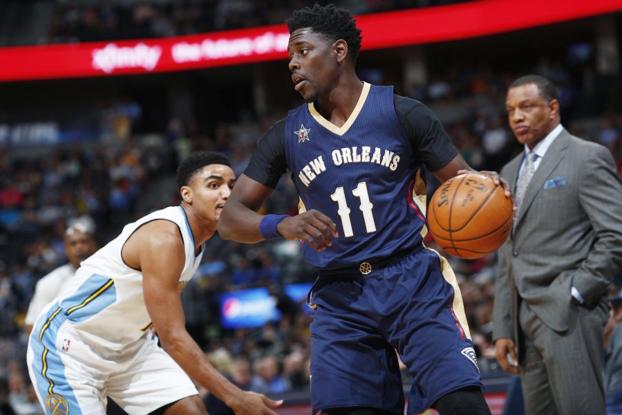 THE FACILITATOR: Jrue Holiday is pictured here dribbling a basketball. He may be the one of the big reasons that the Pelicans may be able to get to the playoffs because of his ability to get the ball to his big men, Davis and Cousins. 