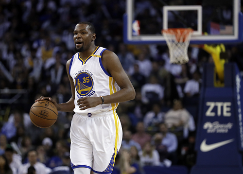 FACILITATOR: Durant is seen dribbling the ball up the court. He is known for his ability to facilitate his offense and find a way to score with the ball.