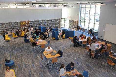 A CEREBRAL SPACE: A shot from the McCammon Mezzanine shows Upper Division students enjoying the new library space to work during their study hall.