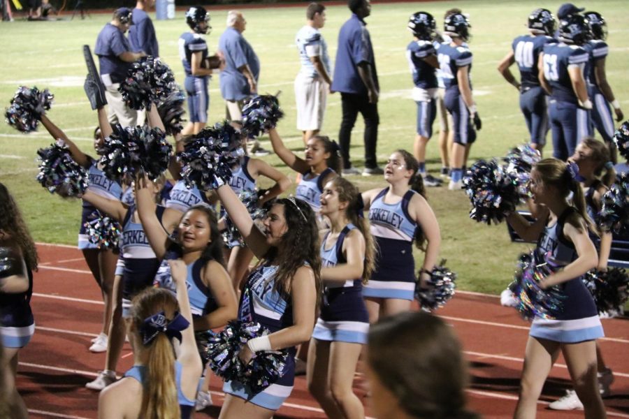 CHEER ON: The Berkeley cheerleaders pump up the crowd for the last football game of the season. 