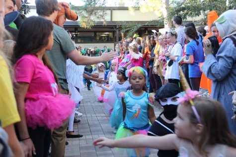 KINDERGARTEN FUN: The kindergarteners start off their fun-filled halloween day with a parade, showing off their creative costumes.