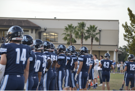 READY TO GO: Berkeley Prep football players size up  opponents before taking the field.