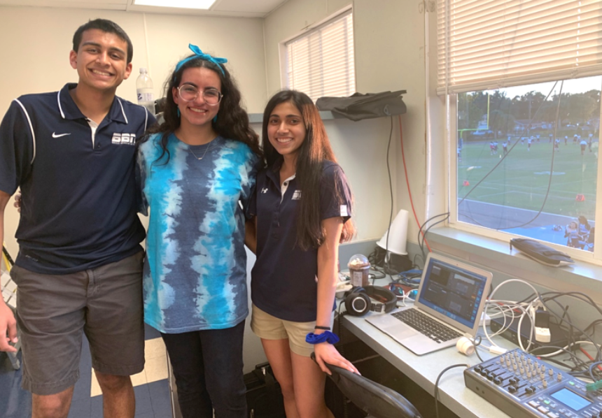 SENIOR SEASON: The Berkeley Broadcast Network’s seniors Raj Ghanekar ’20, Leana Fraifer ’20 and Charvi Sharma ’20 (from left) pose for a picture after setting up for the big homecoming game broadcast. 
