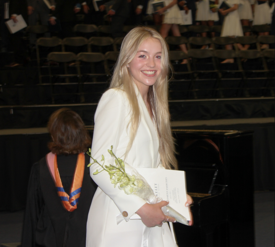 SO LONG: Elle Lawson ’21 smiles as she walks off the stage with her diploma in hand.