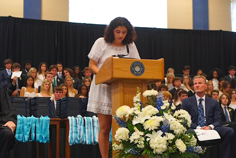 FLIPPING THE PAGE: As Sophia reads her poem, one chapter closes while the other opens. (Photo Credit: Meghna Bukkapatnam)