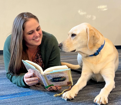 READING AND RELAXING: Fletcher enjoys reading and wants everyone, even comfort dog Slater, to enjoy it as well.