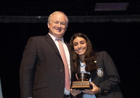 UNSUNG HERO: Giana Moussa ’23 holds her newly received Betty-Bruce H. Hoover award, which honors a student who helps the community without any expectation of reward. (Photo Credit: Christopher Woods).