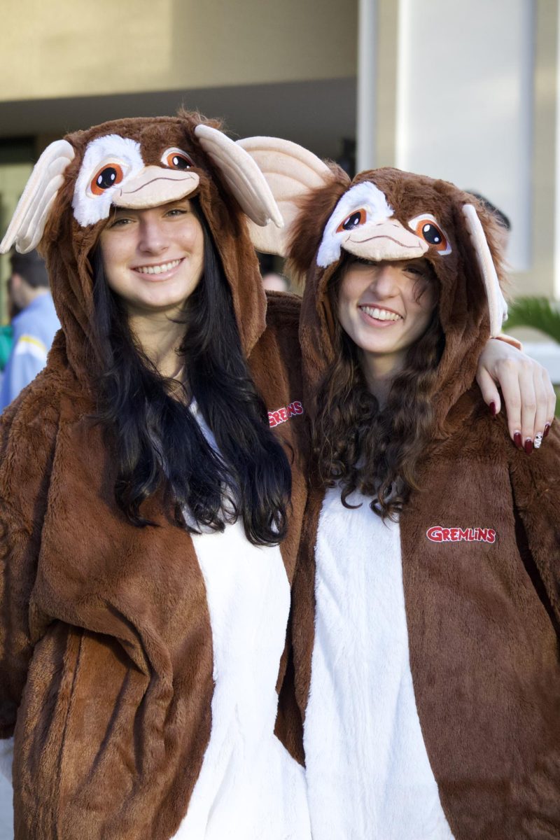 TWIN TERROR: Nina Tora ’24 and Taylor Rauber ’25 (left to right) wear matching costumes from the horror/comedy film “Gremlins.”