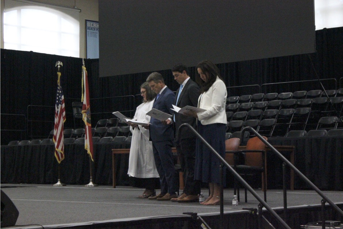 Respect: The platform party stands in silent prayer. 