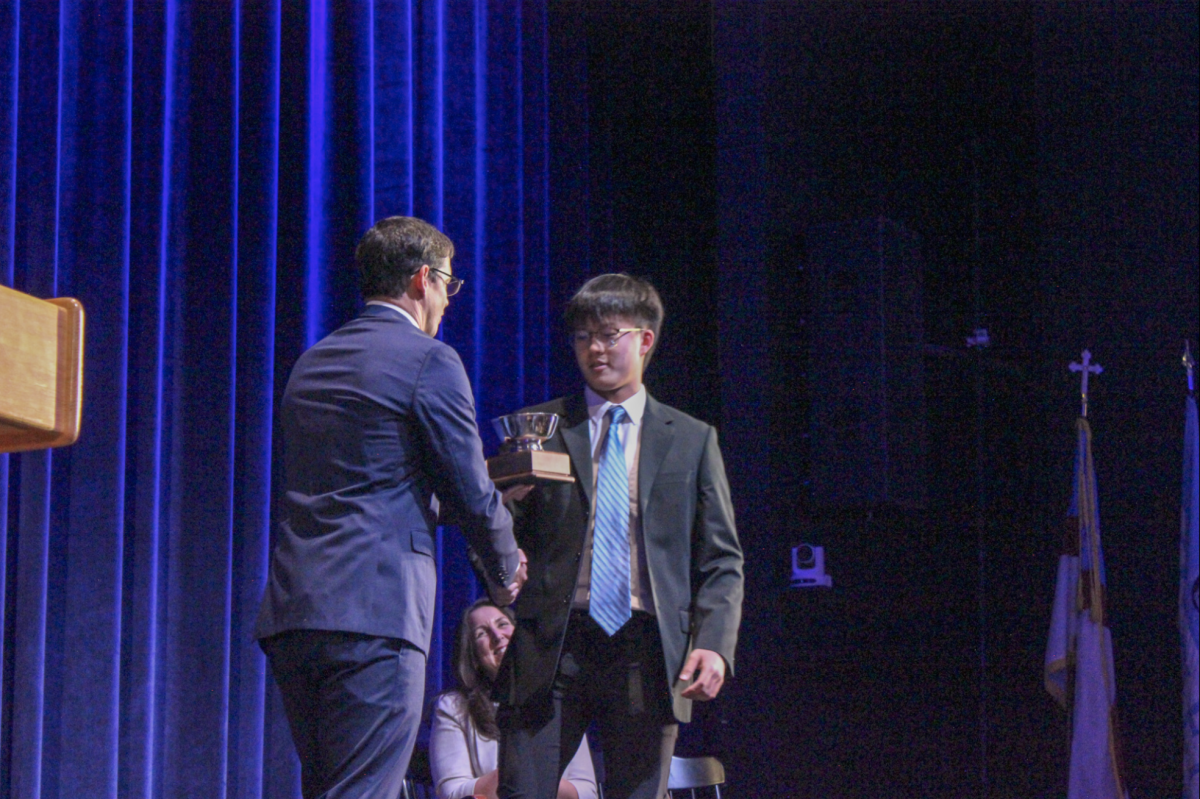 Dedication: Chilok Mak ’27 receives the award for the top scholar in the Upper Division – the Baker-Aye Award.