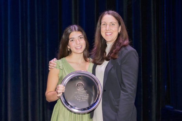 Deserved Distinction: Interim Head of School Kim Graham Lawless awards Sage Bischof ‘26 with the Headmaster’s Trophy